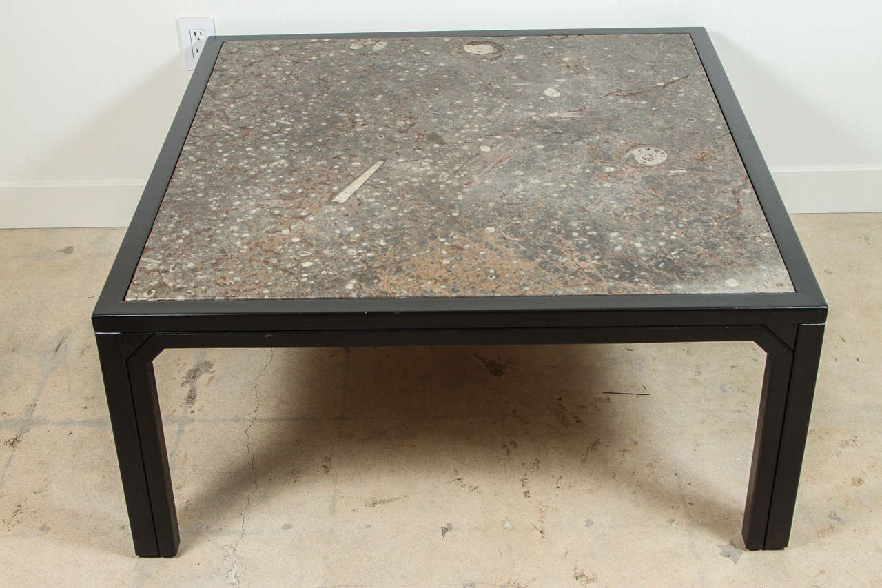Fossil Stone and Ebonized Wood Coffee Table by Ronald Schmitt.