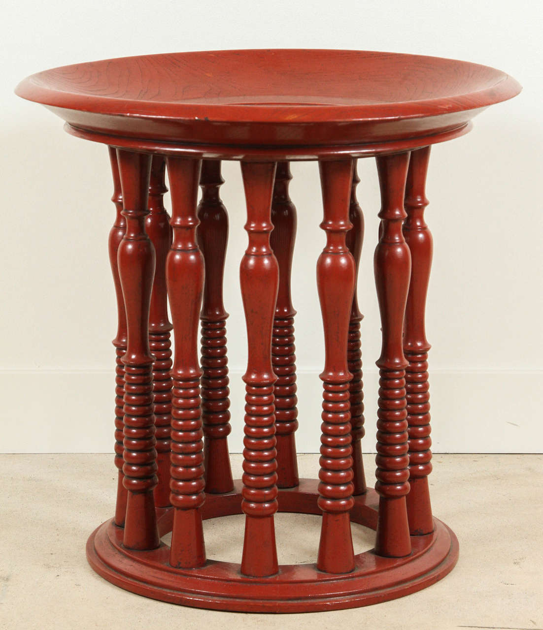 Red lacquered turned oak side table.