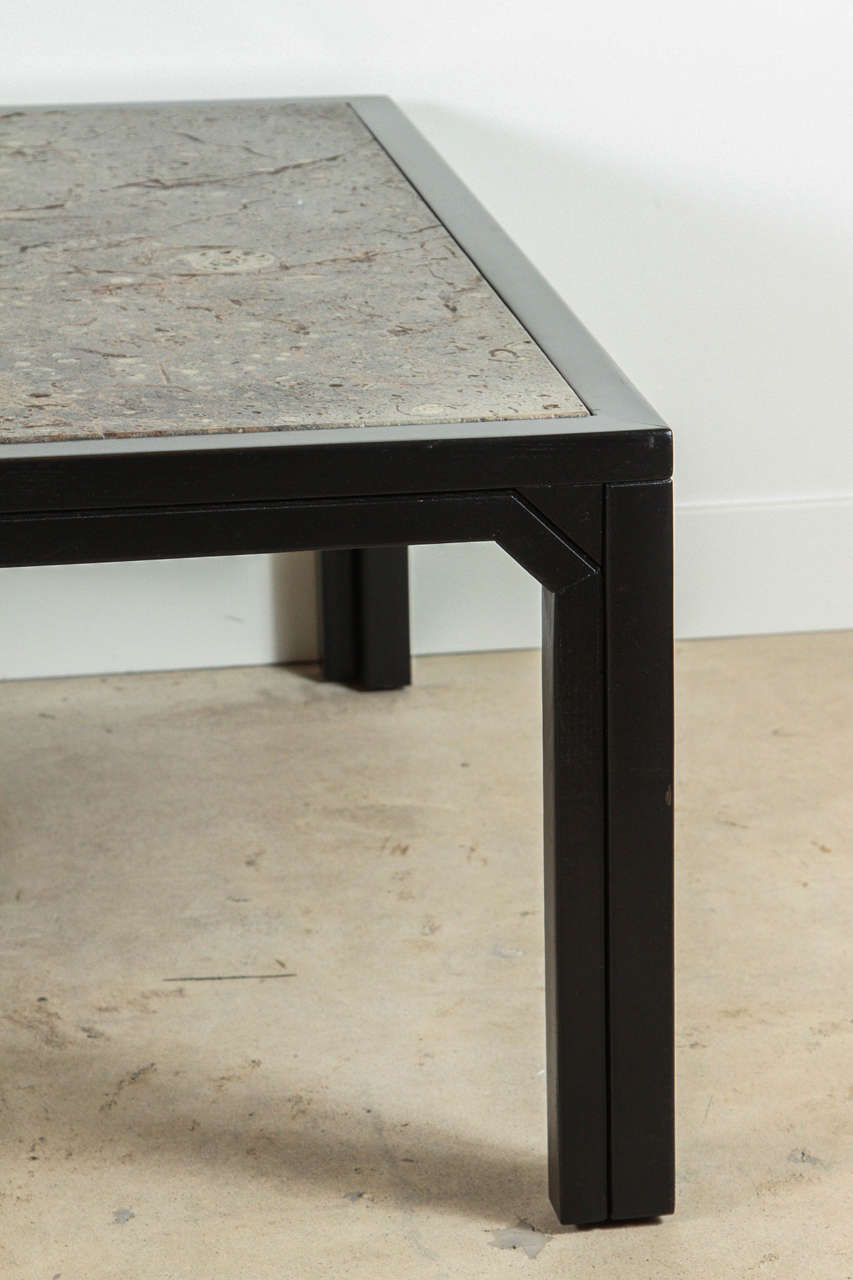 Fossil Stone and Ebonized Wood Coffee Table by Ronald Schmitt at 1stdibs