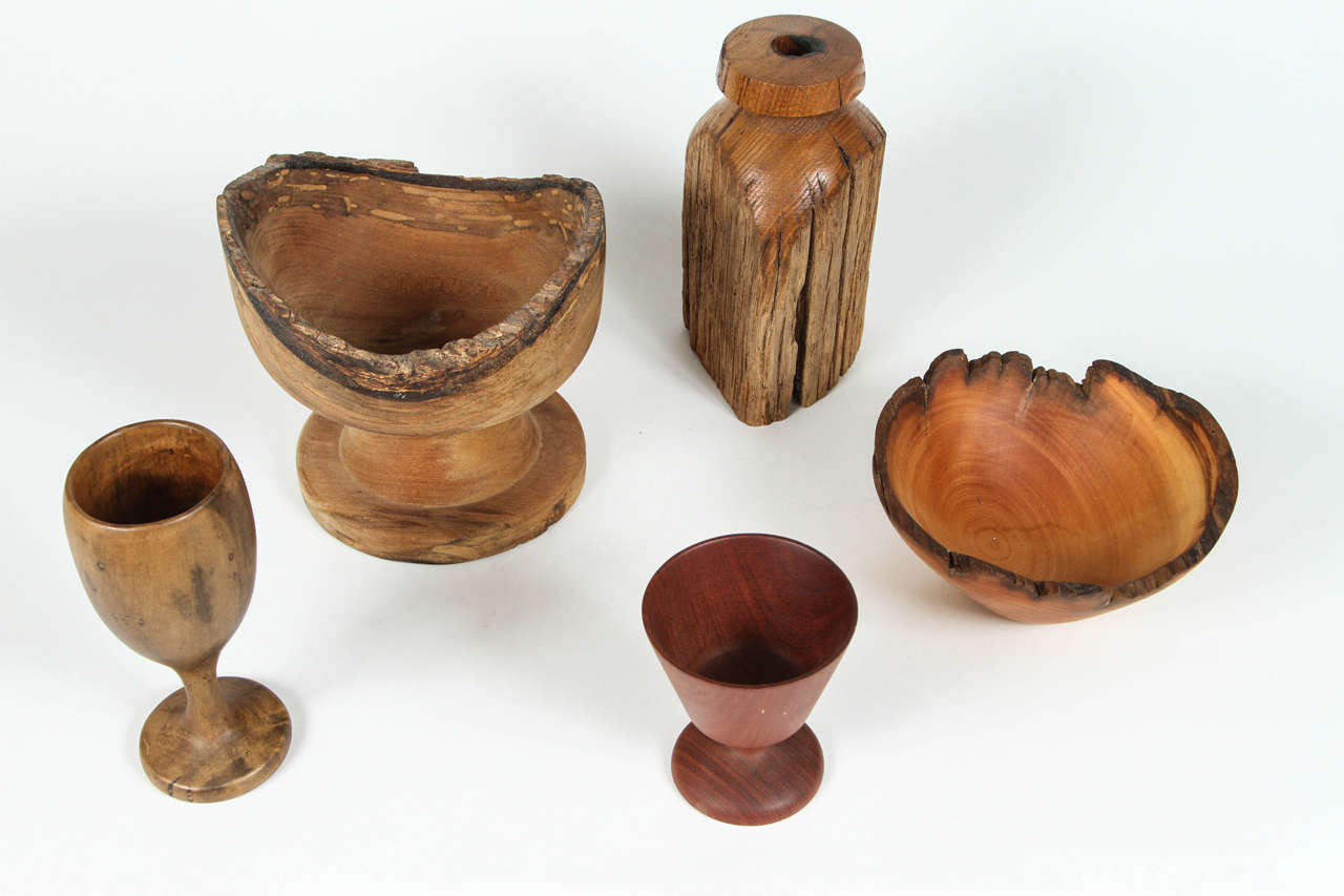 Collection of carved rustic wood vessels. 

Footed bowl 7 x 7