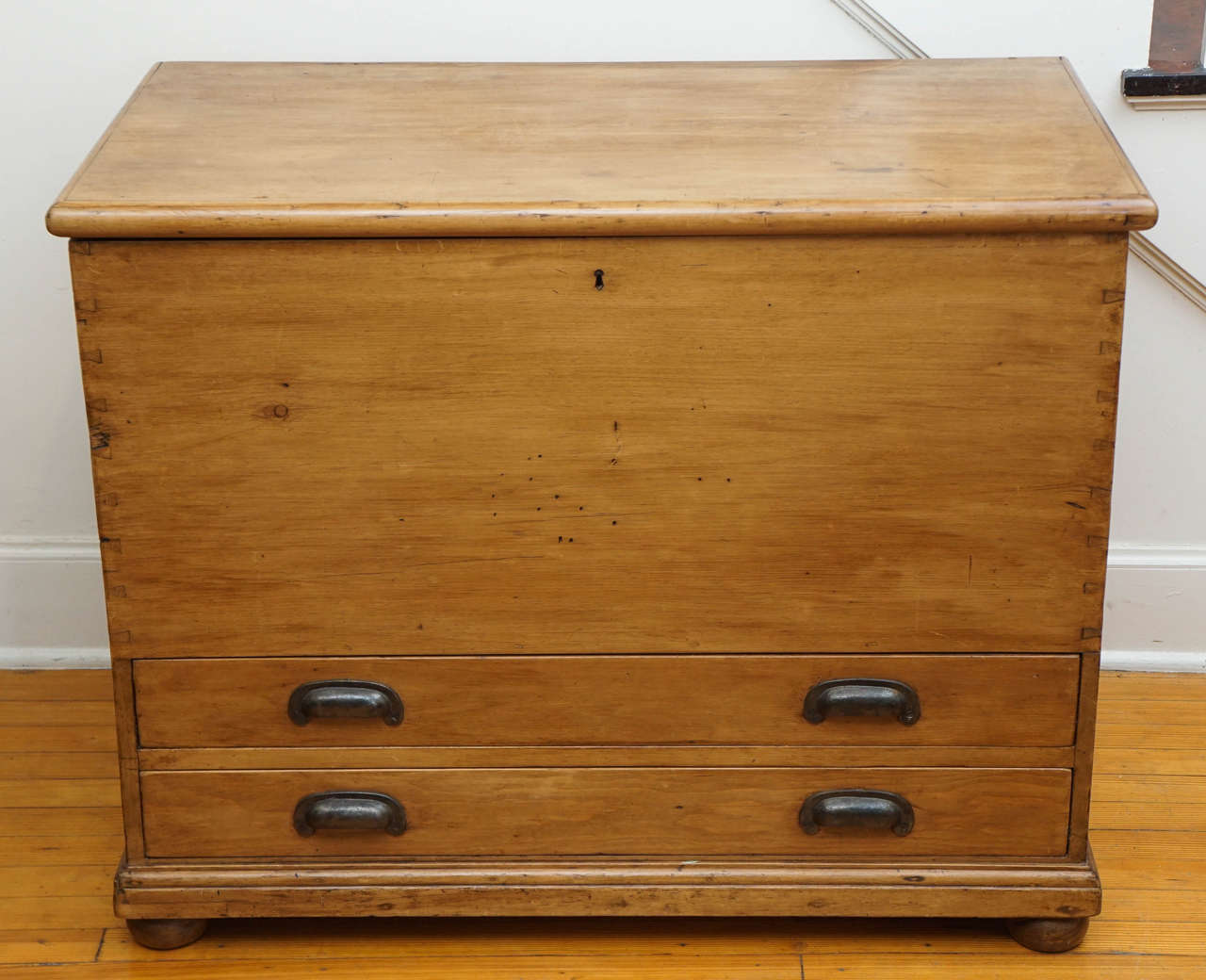 It is rare for us to find a mule chest. This is a wonderfully useful piece of furniture at a reasonable price. The top opens for deep storage and there are two drawers underneath for additional storage. Original hardware and a rich patina are the