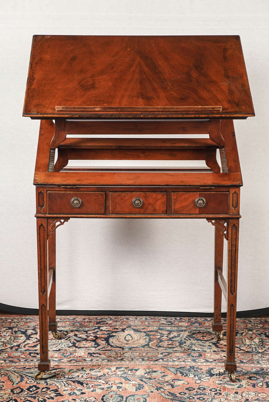 Nice English late 19th century mahogany adjustable architect's table. Solid mahogany and mahogany veneered top and supports. Adjustable height from 30