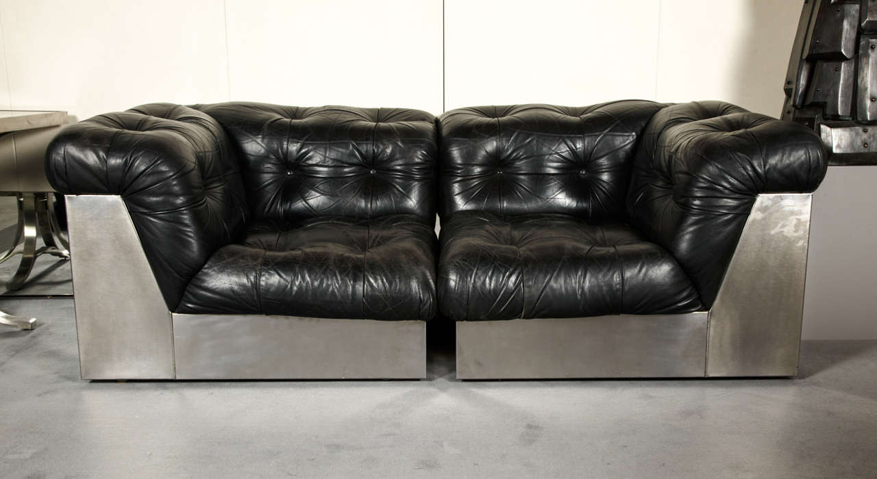 Giorgio Montani for Souplina.
Original and elegant pair of black chesterfield armchairs with steel base. 
Circa 1970.
Italy.
Good condition with minor wear consistent with age and use.
Can be used as two armchairs, lounge chairs, or as a sofa