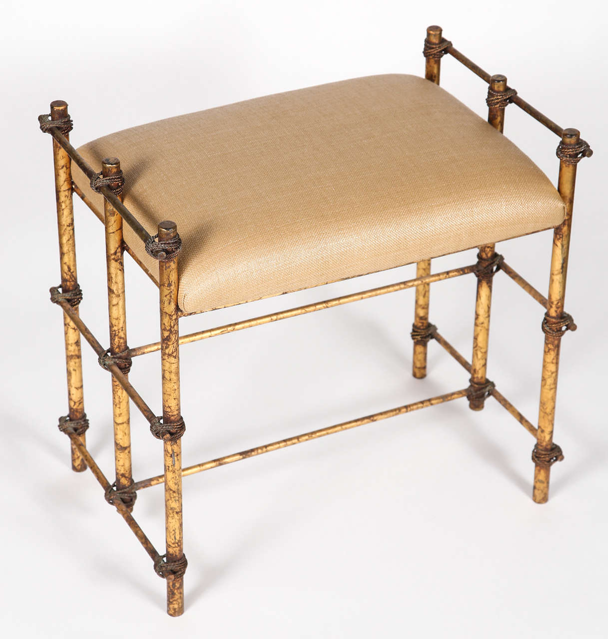 Vintage stool with gold metal base and newly upholstered seat.