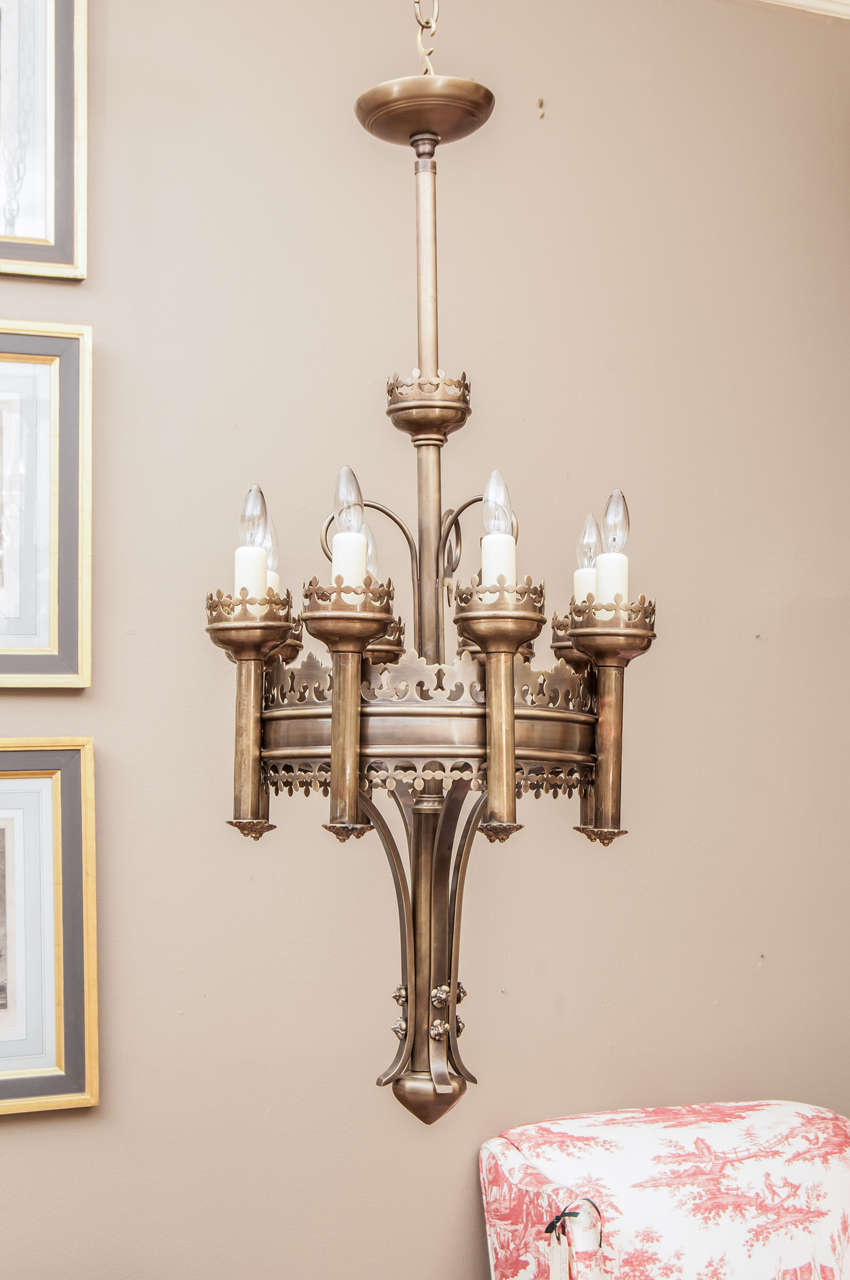 Possibly Russian, handcrafted eight-light chandeliers, cleaned old finish trefoil ornament height can be adjusted ceiling cap and hanging hardware included.  Price is for the pair, but we will consider selling separately. 