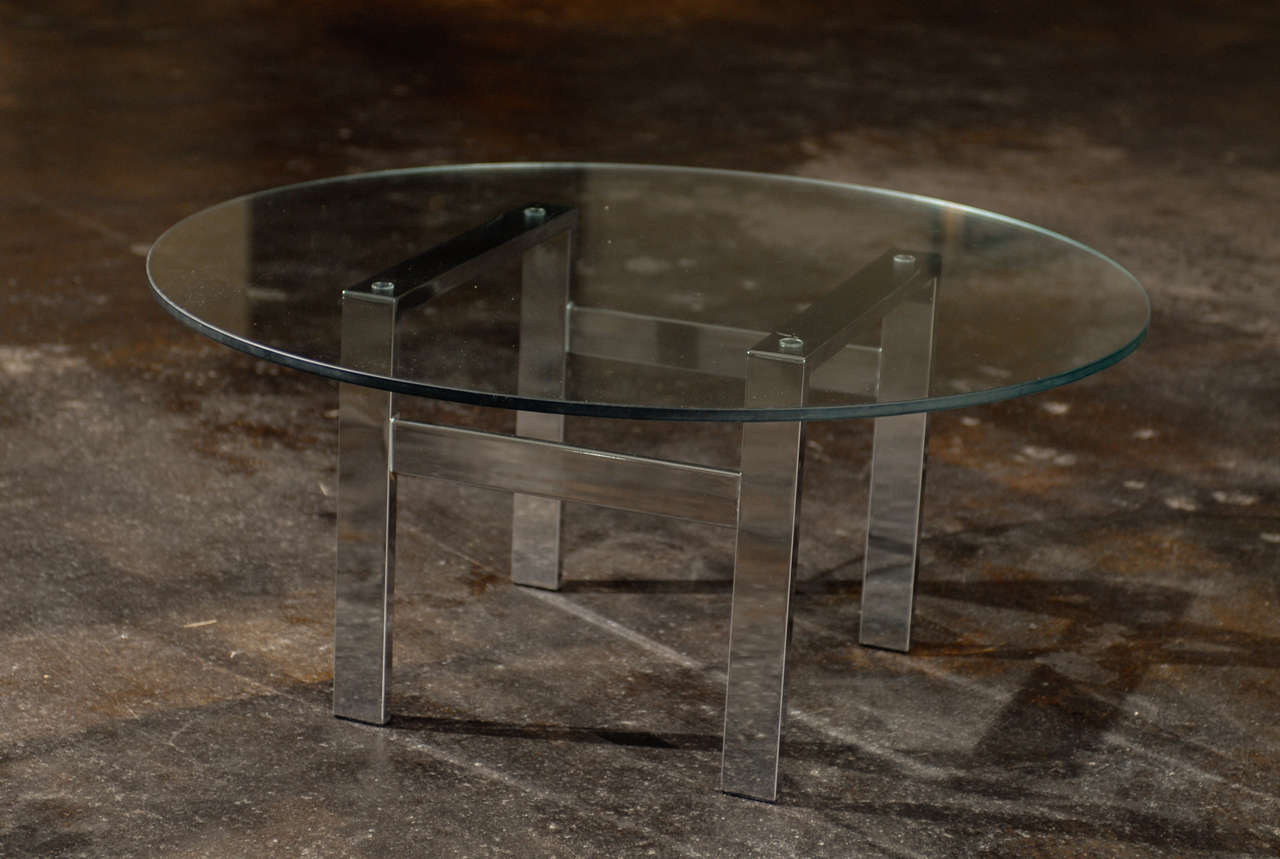 A Handsome chrome and glass flat bar coffee table. While the piece is unmarked, it is reminiscent of Milo Baughman for Thayer Coggin production of the 1970's. Excellent Vintage Condition, chrome is clean with no pitting. The base can accommodate a