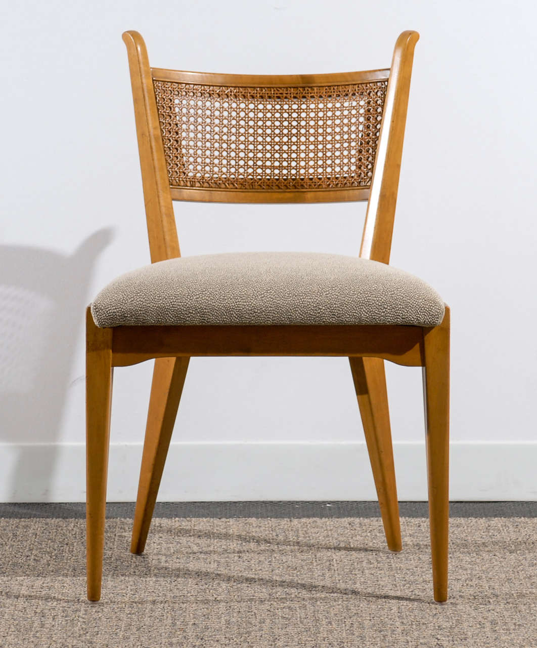 A superb set of a very difficult to find series of chairs by Edmond Spence, circa 1950's. Birch with cane backs. Excellent Restored Condition, with wonderful patina. The price noted is for the set of four (4) chairs.