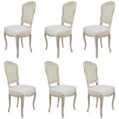 Six chaises d'appoint peintes avec dossier en rotin