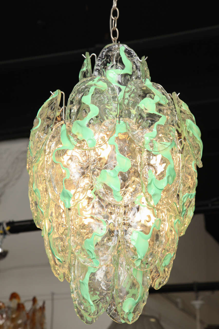 Stunning chandelier designed by Carlo Nason, made in Venice by Mazzega Murano.
Handmade glass with streaks of green running through the clear leaves.
Great quality.
  