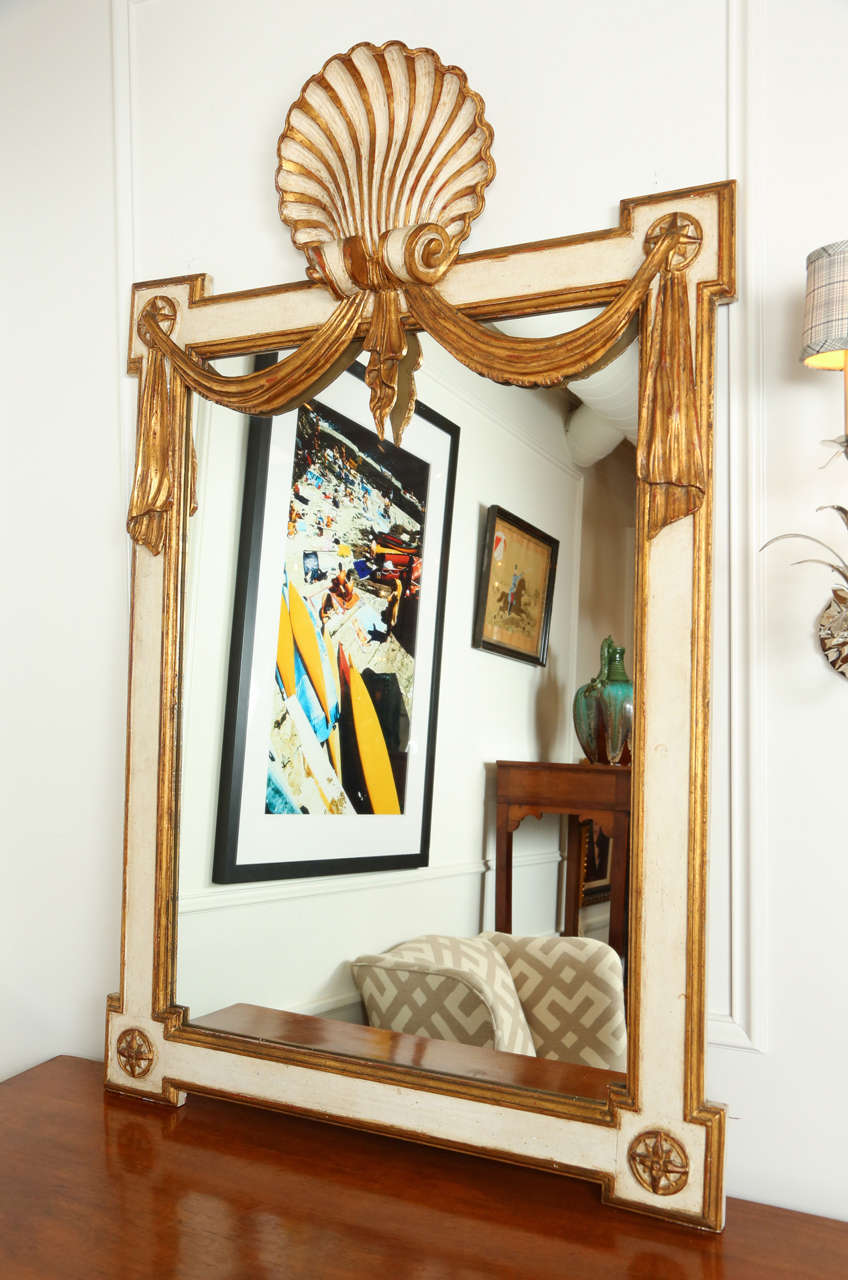Paint and parcel gilded Italian coquille mirror with swags. Early 20th century.