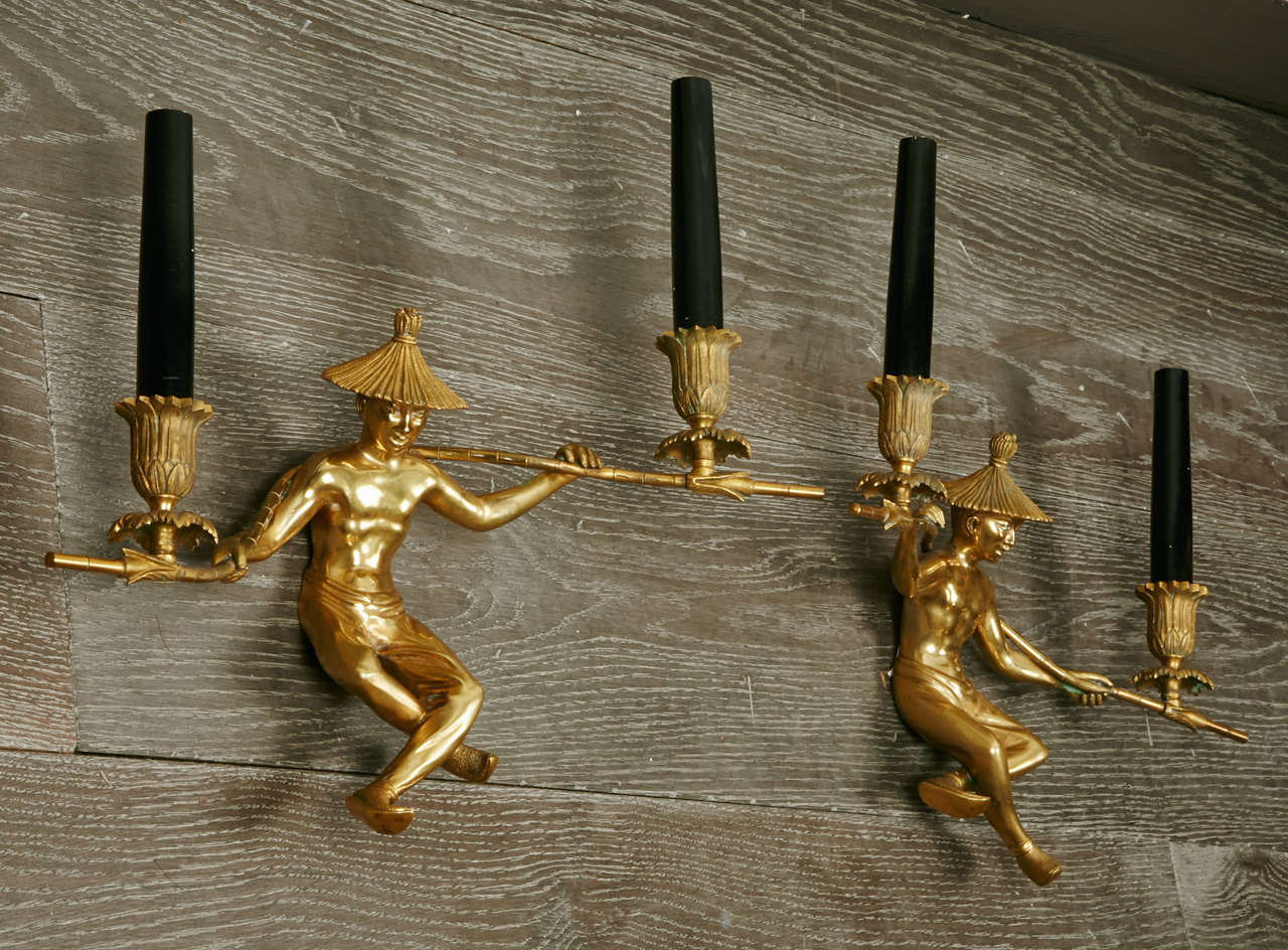 Rare pair of wall lamps with decoration of Chinese in bronze.
 High quality of bronze and details.
 By Jansen.