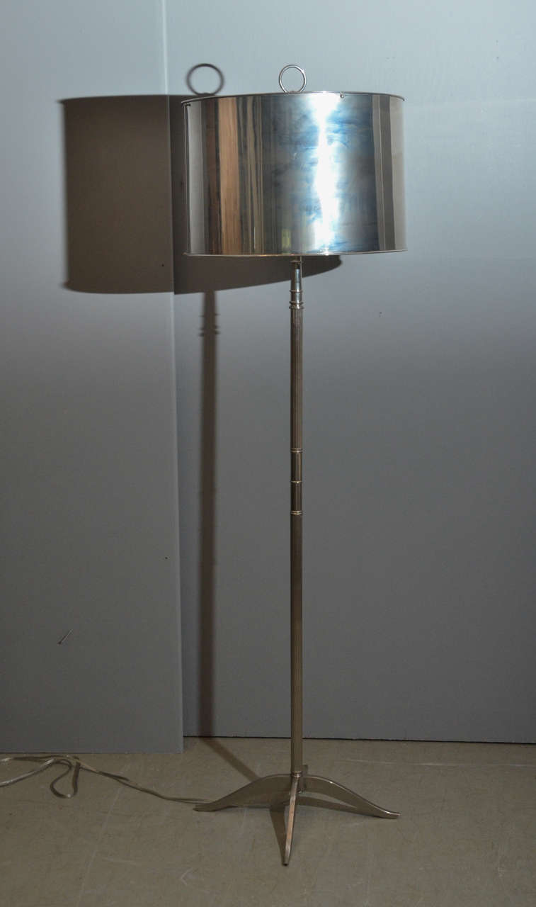 Nickel floor lamp with drum shade. Beautiful finial and elegant base.
