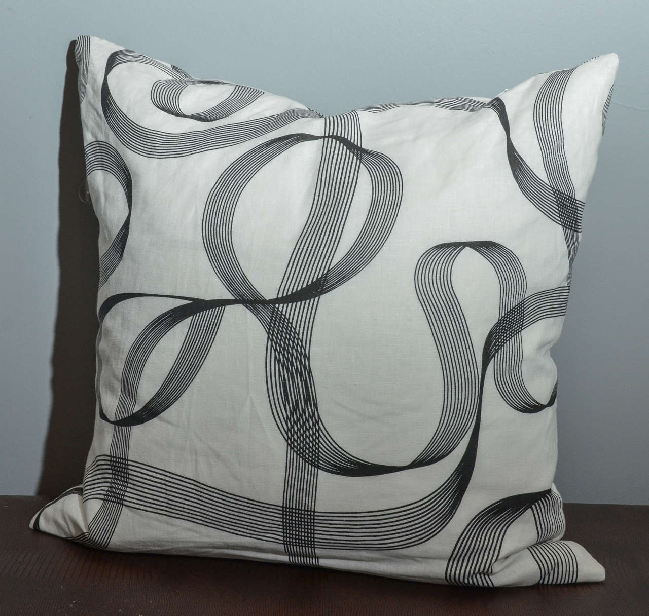 Bold modern ribbon patterned cotton pillow with high quality down blend insert.