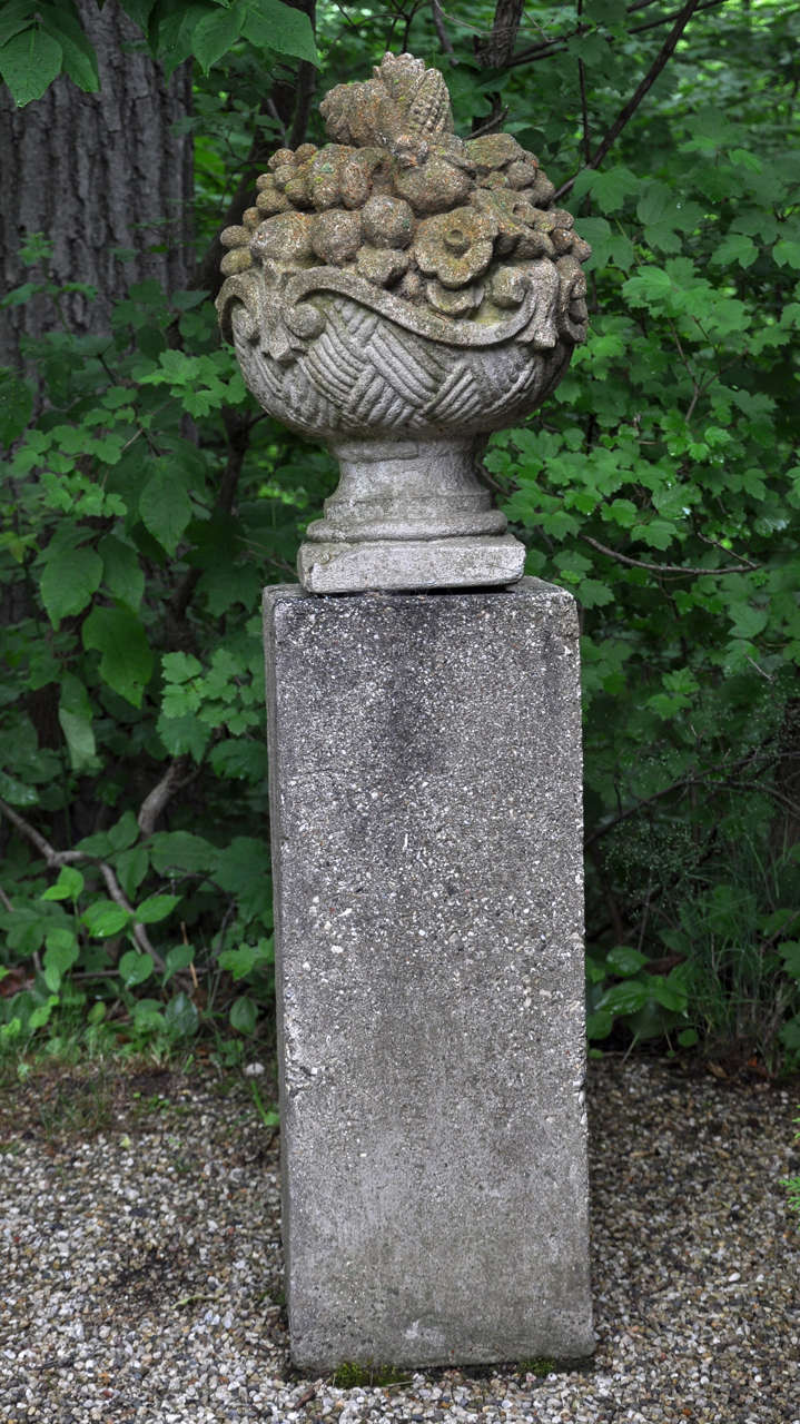 Cast concrete composition floral urn on base companionable to urn.