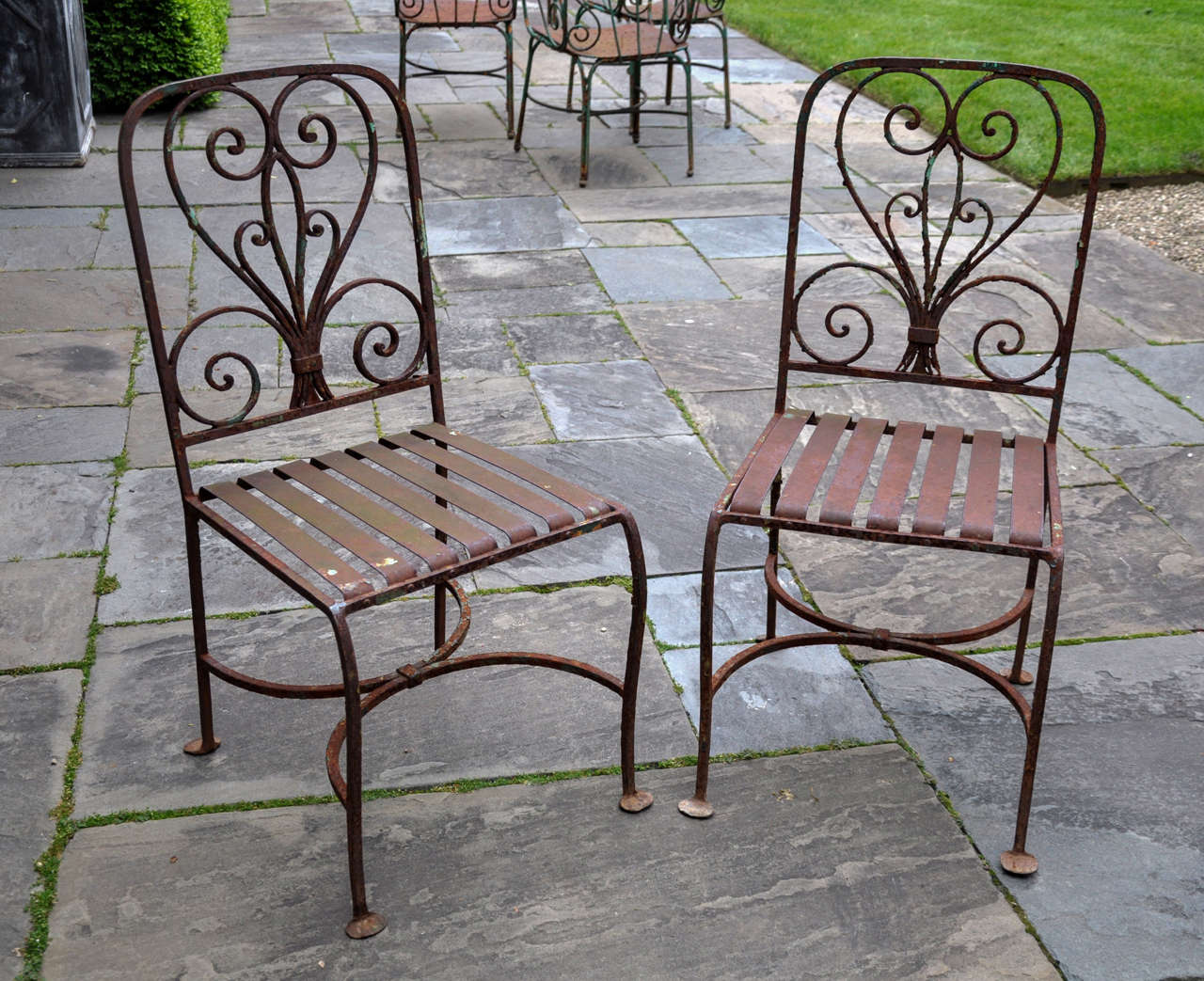 Two Companionable Iron Garden Chairs to our 