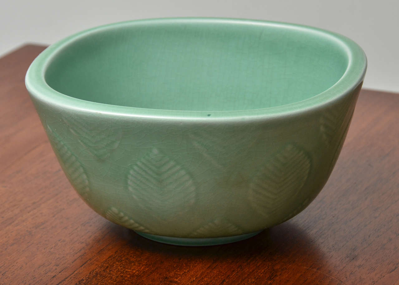 Pleasing Bowl Designed by Nils Thorsson with matte Seafoam glaze and Raised linden leaf Ornament.  Danish, circa 1960s. Uncommon ornament.