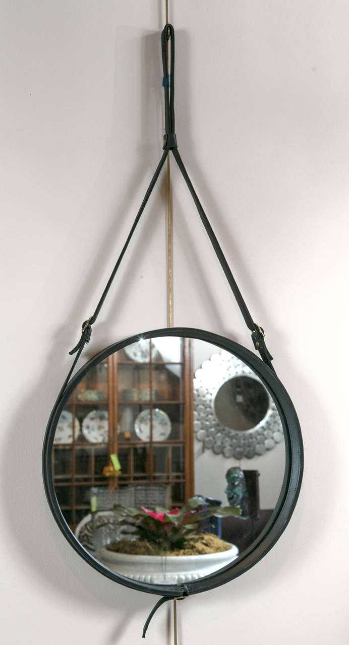 Circular strap mirror, made from leather in the manner of Jacques Adnet.