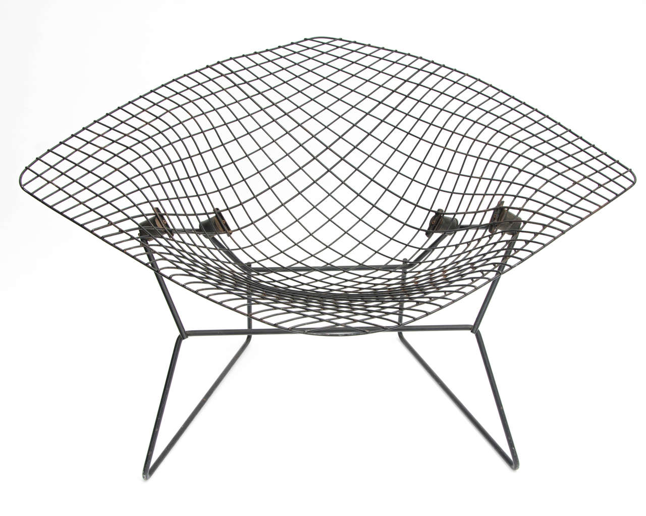 An early model of Bertoia's iconic wide diamond chair, designed in 1952 for Knoll.

This piece has been in the same home since acquisition in London in the 1950s and has seen only occasional use. Made of fine bent and welded steel wire, finished