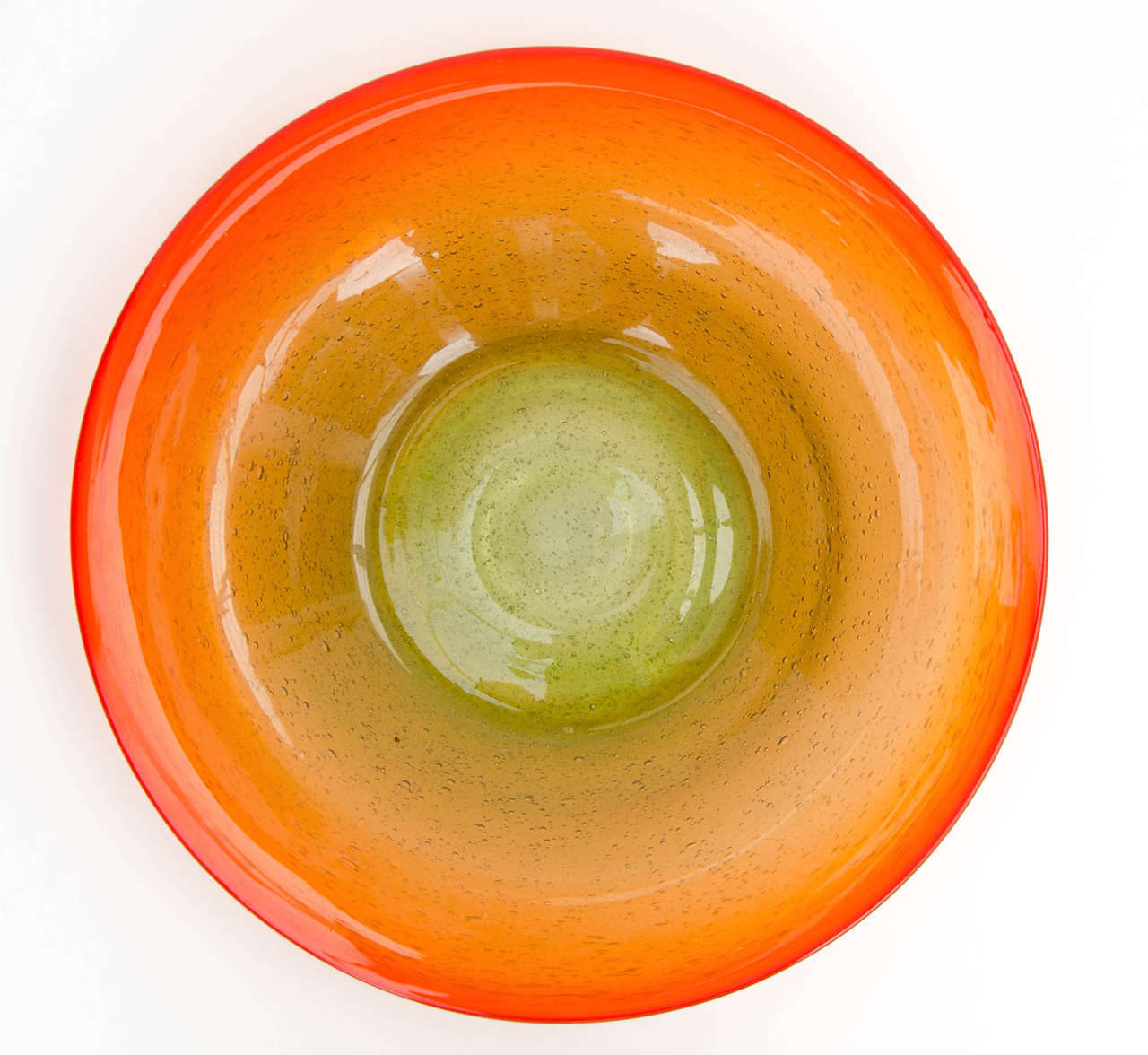 Mid-Century art glass dish in shades of orange and green with bubbles by Oiva Toikka.

Oiva Toikka, born 1931, is a Finnish artist and designer. He began his career at the Arabia ceramics factory and became art director at the Nuutaja¨rvi