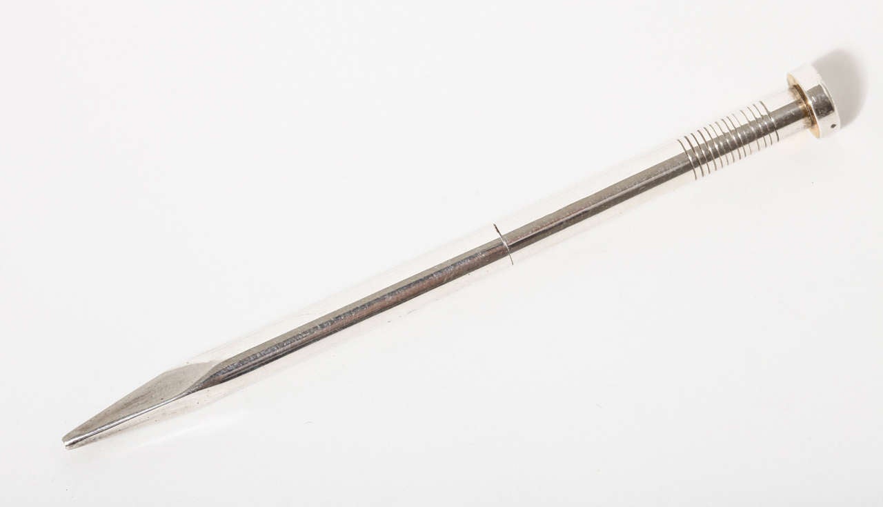 A mid 20th Century novelty sterling silver propelling pencil by Villiers & Jackson. The pencil has a twist mechanism to propel the lead. The end of the nail unscrews to fill the lead. Hallmarked Birmingham, England, 1956. Signed 