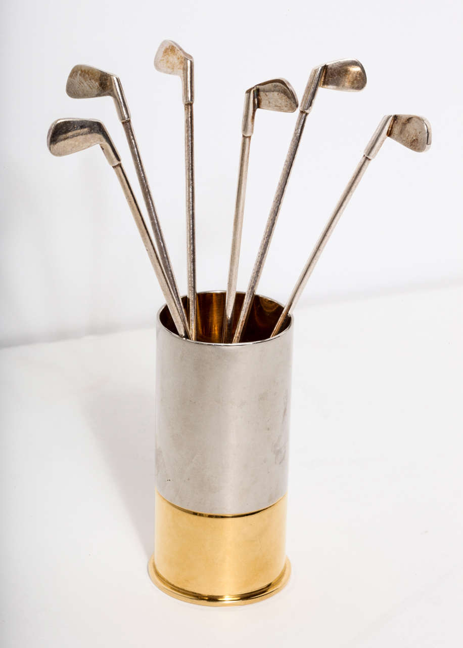 A very rare and stunning set of 6 top quality, highly detailed golf club cocktail stirrers housed in a shotgun shell inspired case.  All of the pieces are made by the luxury French fashion house; Hermes.
Each piece is silver plate and stamped
