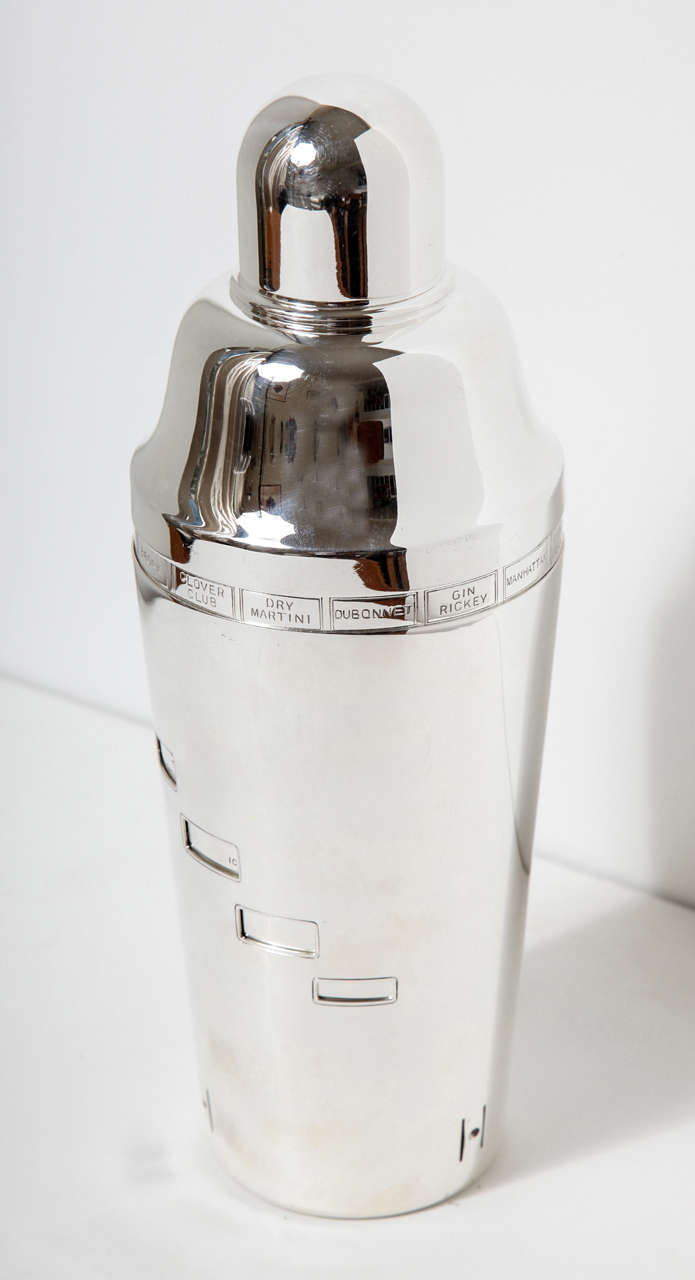 Large Art Deco silver plated recipe cocktail shaker by Napier. The outer sleeve rotates to reveal recipes for 15 different cocktails such as a Manhattan, Gin Ricky,  Clover Club or Bronx. Each drink can be made by reading the instructions through