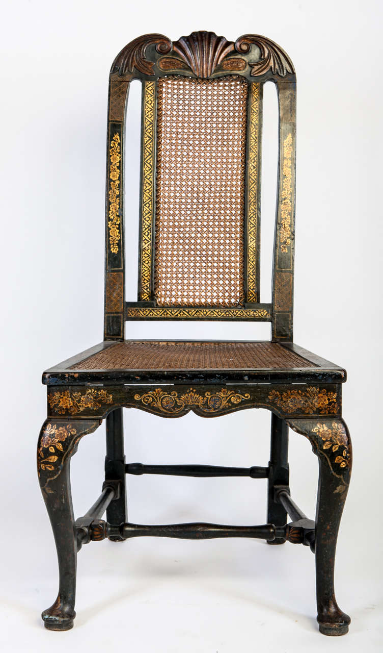 A fine set of six English 18th century blue painted and parcel-gilt chairs with vase shaped back splats and caned seats,
Over cabriolet legs with pad feet.