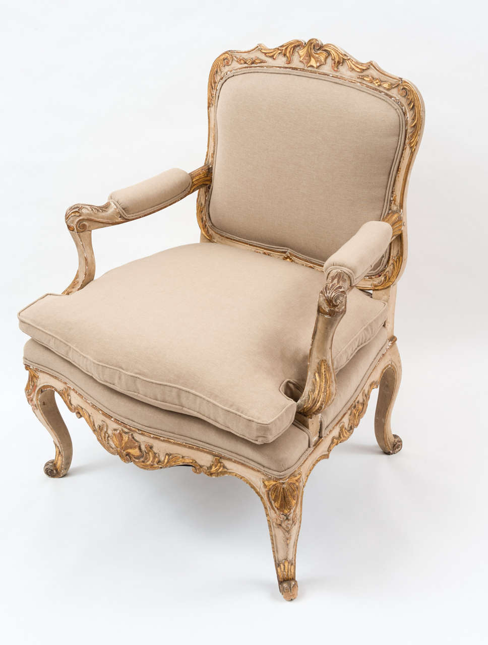 An Italian upholstered armchair from the late 18thc, with bags of charm in its original paint and gilt finish.