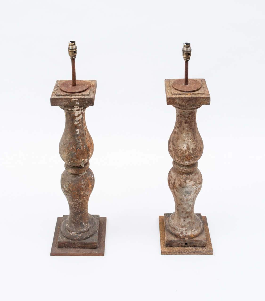 A Pair of Cast Iron Baluster Lamps