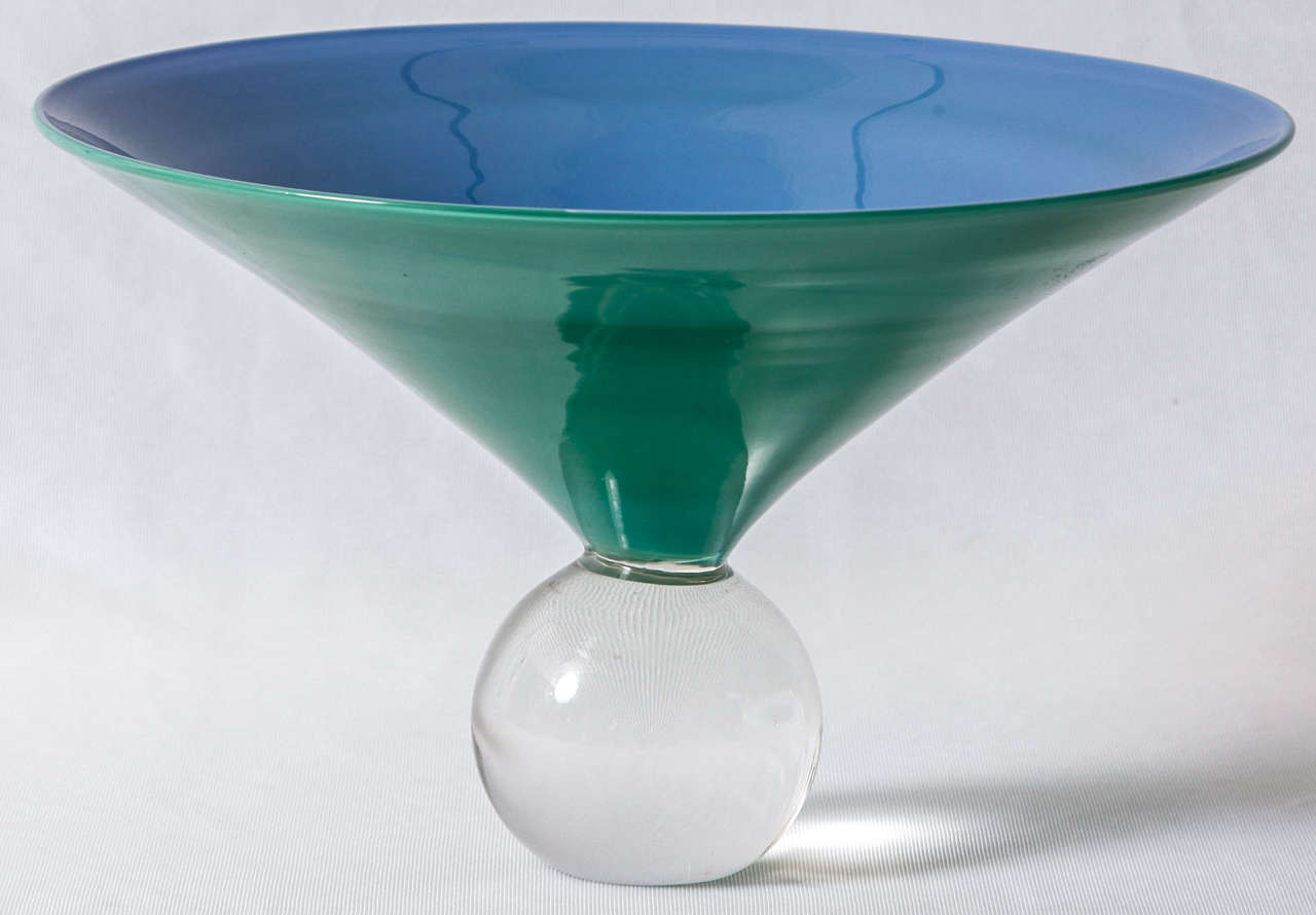 'Biro' glass vase from the Memphis period designed by the Italian glass artist Laura Diaz de Santillana, grand-daughter of Paolo Venini, and executed by Venini glassworks in Murano, Italy. 
Hand-blown blue and turquoise opal glass on a solid clear