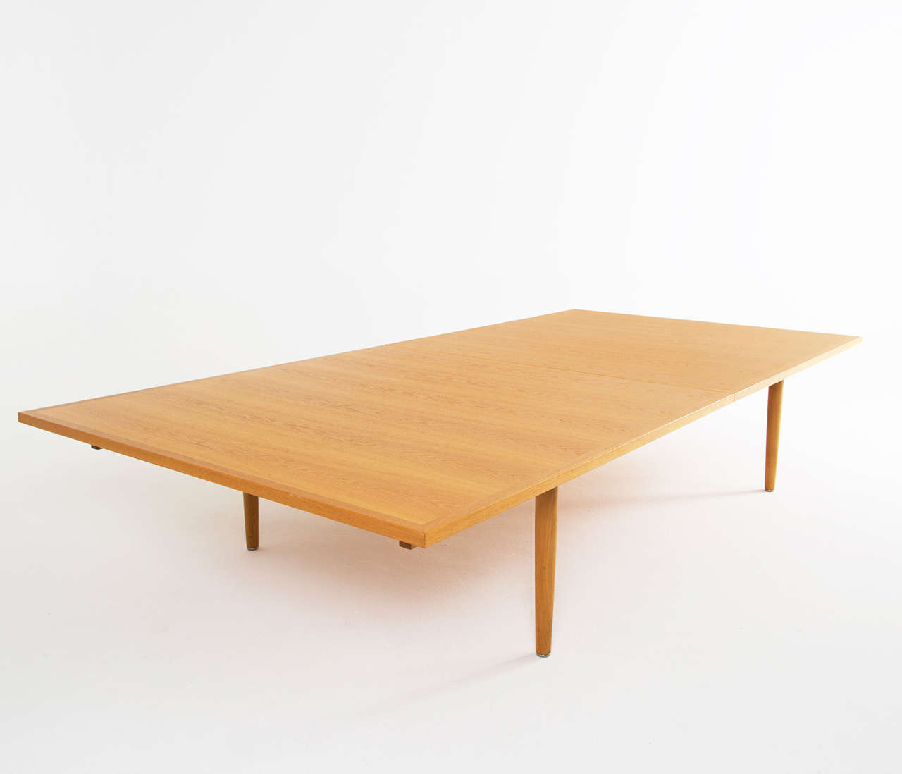 Table in oak by Hans Wegner for Johannes Hansen, Denmark, 1960s. 

Extremely large conference table by Hans Wegner for Johannes Hansen in oak. The top is made with beautifully made oak veneer in a frame out of solid oak.

Free shipping for all