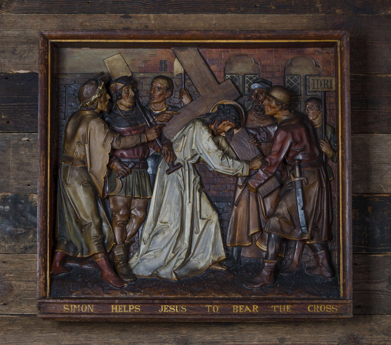 A set of eight Stations of the Cross salvaged from an old London church. The plaques are expertly made in high relief from plaster and are hand-painted. They sit in deep wooden frames, each marked with which part of the story of the crucifixion they