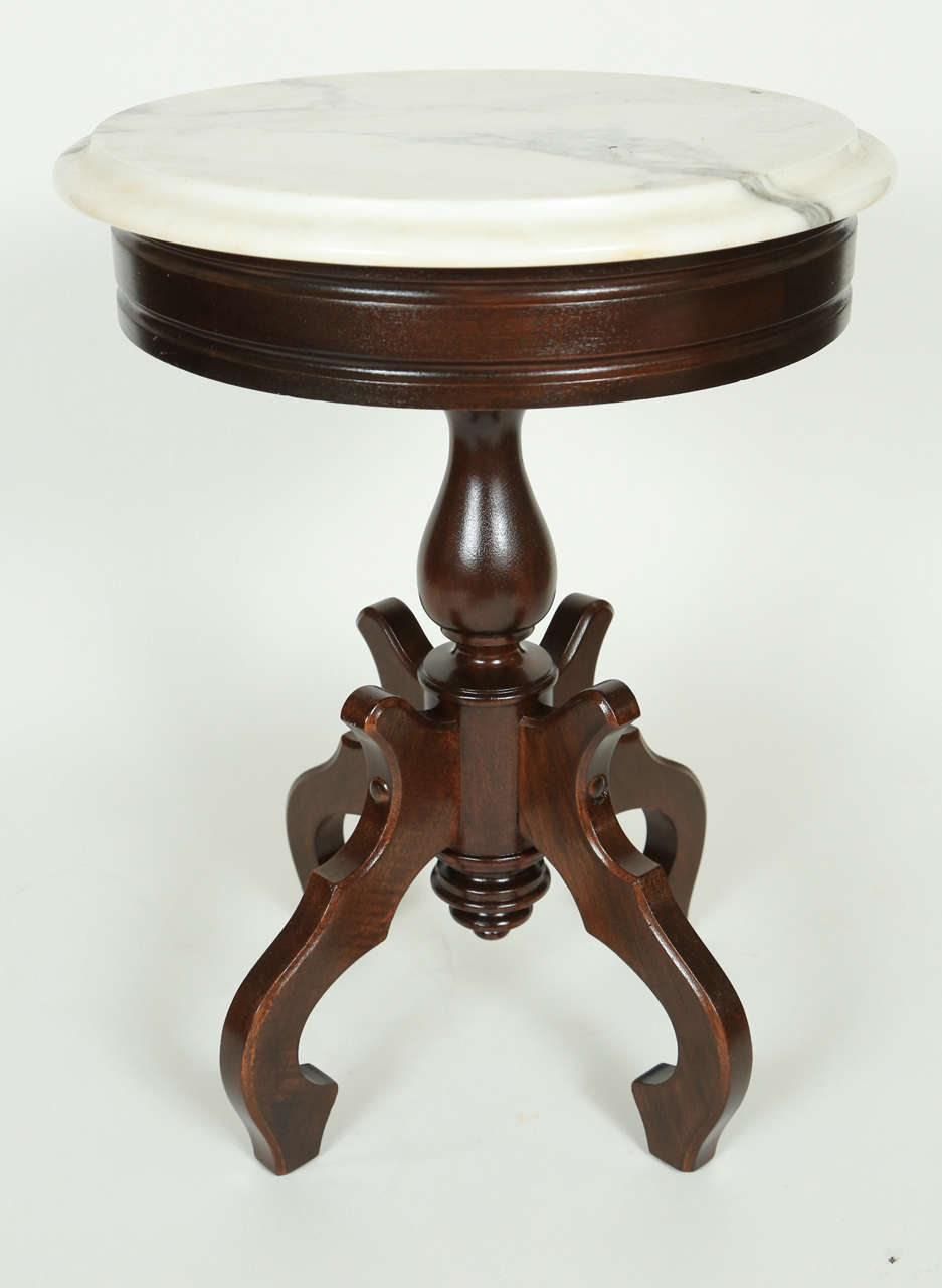 Small Victorian mahogany table with white marble top. Base newly refinished.