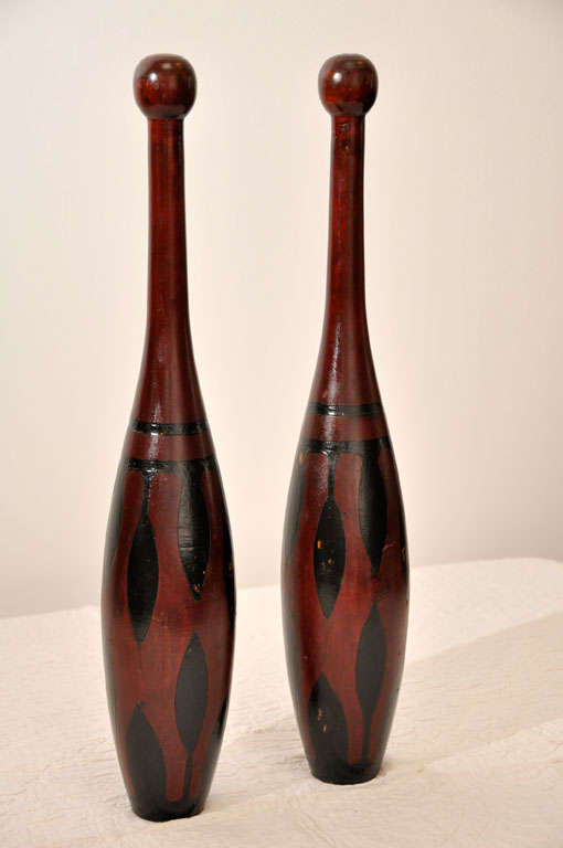 Fantastic pair of rare and unusual paint decorated with a burgundy and black paint. The pair are signed 
