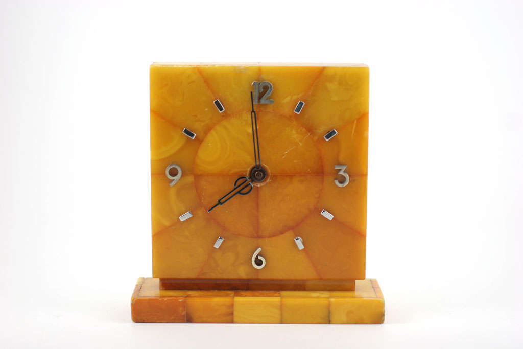 Antique amber desk clock with silver numbers and markers