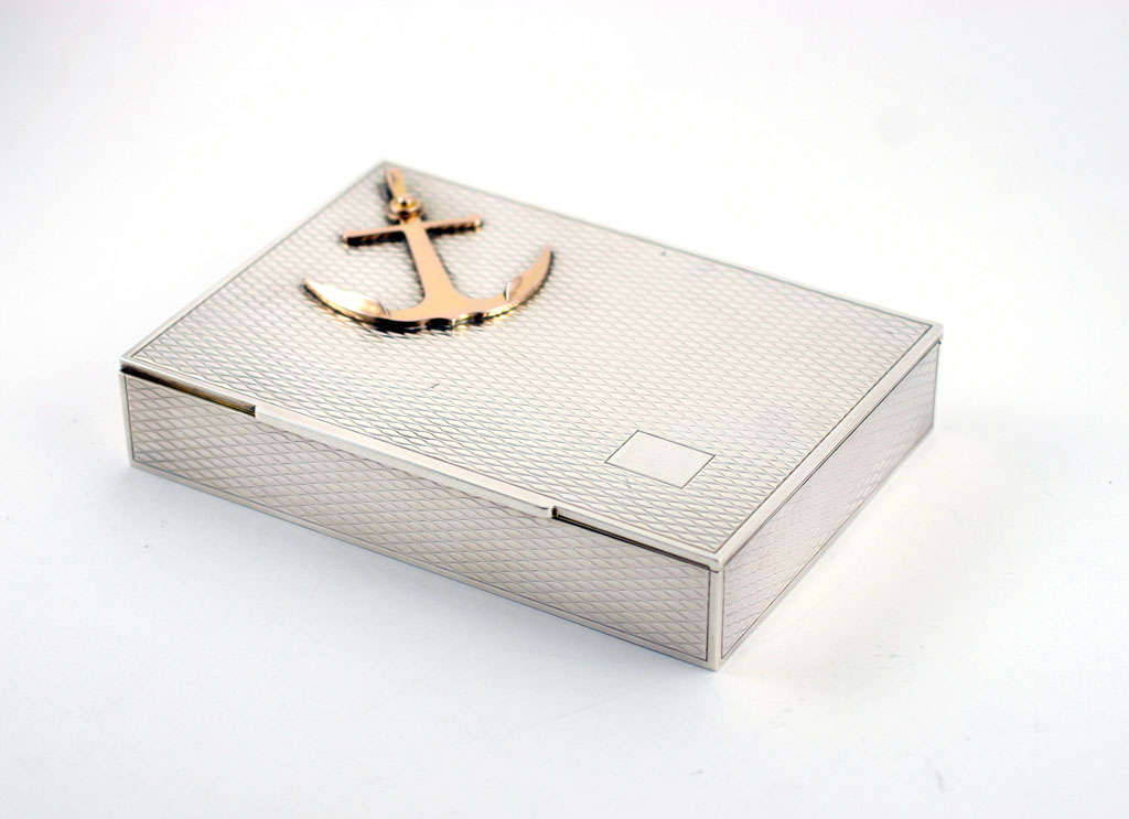 Hermes sterling silver engine turned box with gilt anchor on lid, gilt interior