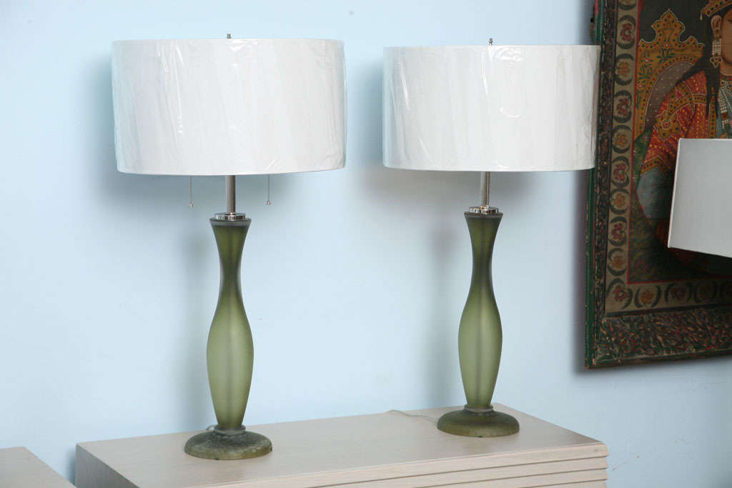 Manufactured by Seguso for Donghia in the 1980,s . These beautifull lamps are glass construction in olive green color with a sand blasted finish.Nickel finish accents and the shades are vanilla color . Each lamp holds 2 bulbs .