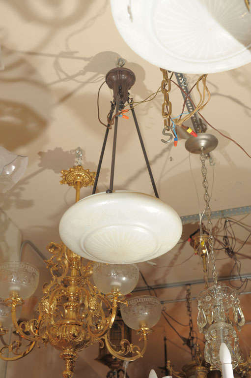 When it comes to Steuben glass, calcite is one of the most unique creations of this well regarded company.  When unlit, they look like a pearl and when lit, they give a warm, soft, yellow light.  The photos don't show how the light bulbs evenly