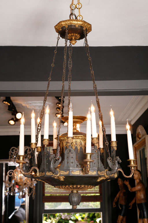 An Important and Historical, early 19th century French Charles X, Fifteen light Oil Chandelier, in Bronze, with an extraordinary provenance.
This fine chandelier hanging from five chains cut in the shape of flowers. The lighting arms in a sequence