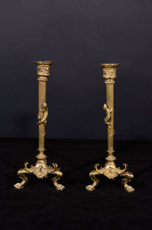 Pair of Gilt Bronze One Light Candlesticks with Reeded Shaft and Lion Paw Feet Bases.  Each Column Has A Climbing Newt.
