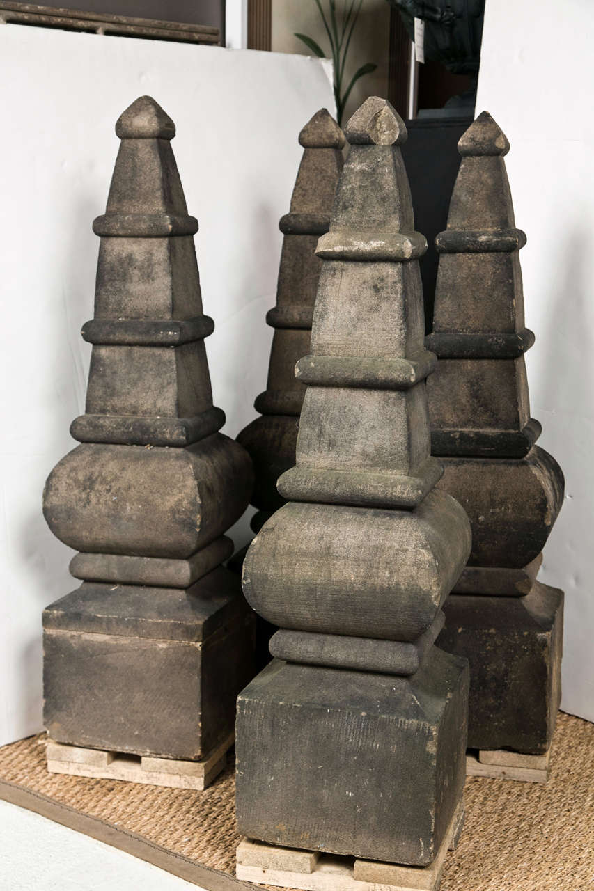 Ornamental stone obelisk sold as pair.  Two pairs available, 4 items total.