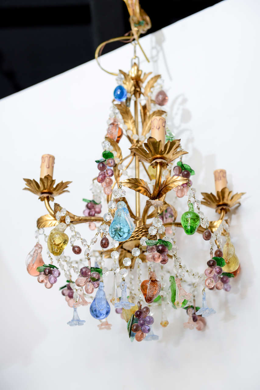 Exquisite Murano chandelier with gilded metal frame and multicolored handblown crystals.