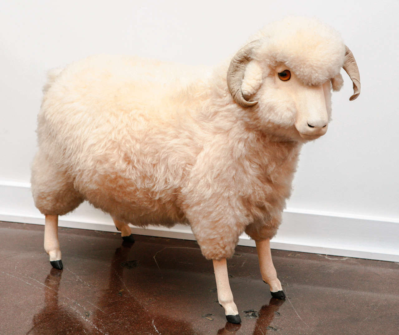 Wonderful vintage life sized sheep, with a thick coat of wool.  Circa 1970's, with glass eyes, wooden legs and horns, and a soft felt covered face.