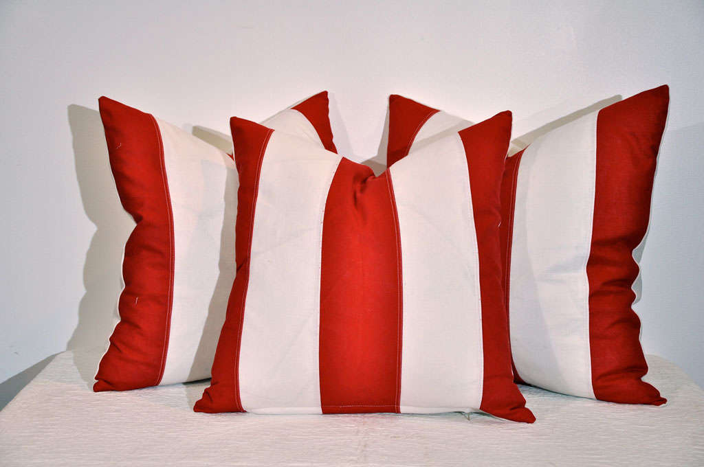 EARLY 20THC STRIPED RED & WHITE FLAG MATERIAL STRIPED PILLOWS.A TOTAL GROUP OF SIX AND SOLD INDIVIDULY AT 195. EACH.