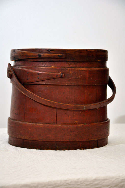 EARLY 19TH C. ORIGINAL RED PAINTED FURKIN FROM MAINE. ALL HANDMADE WOOD PEGS CONSTRUCTION WITH HANDMADE NAILS. THIS BUCKET WAS USED TO HOLD SUGAR.