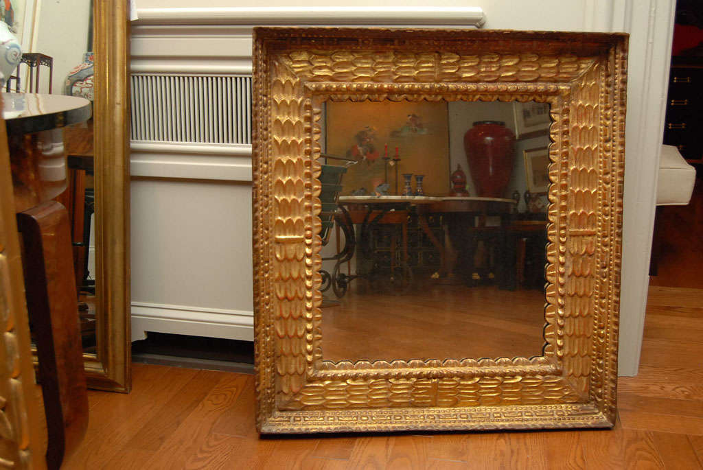Spanish gilded frame with imitation antique mirror glass.
    
