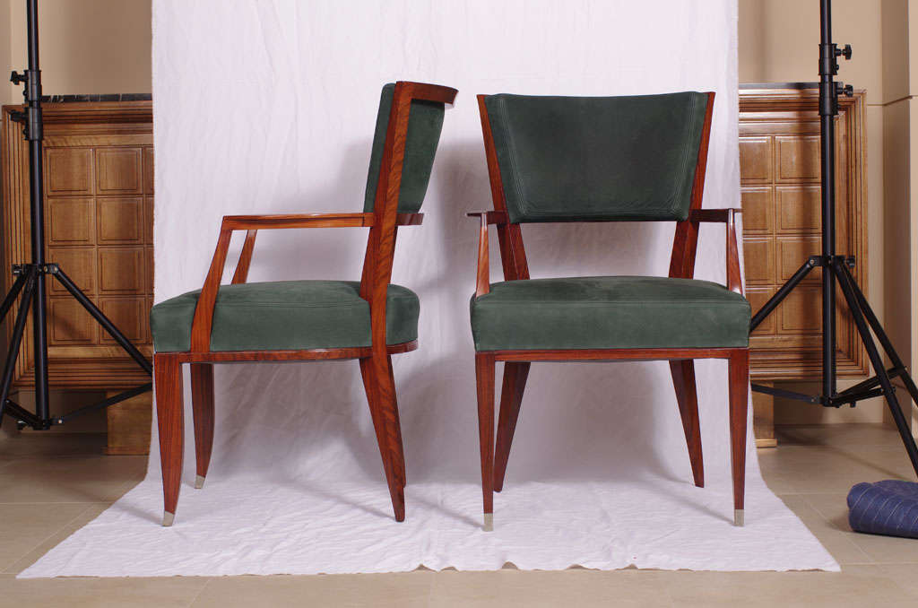 Pair of arm chairs in french polished  rosewood with nickel sabots and green suede upholstery