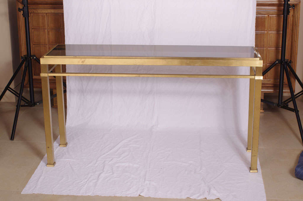 Console table in gold mate bronze with smoked glass top