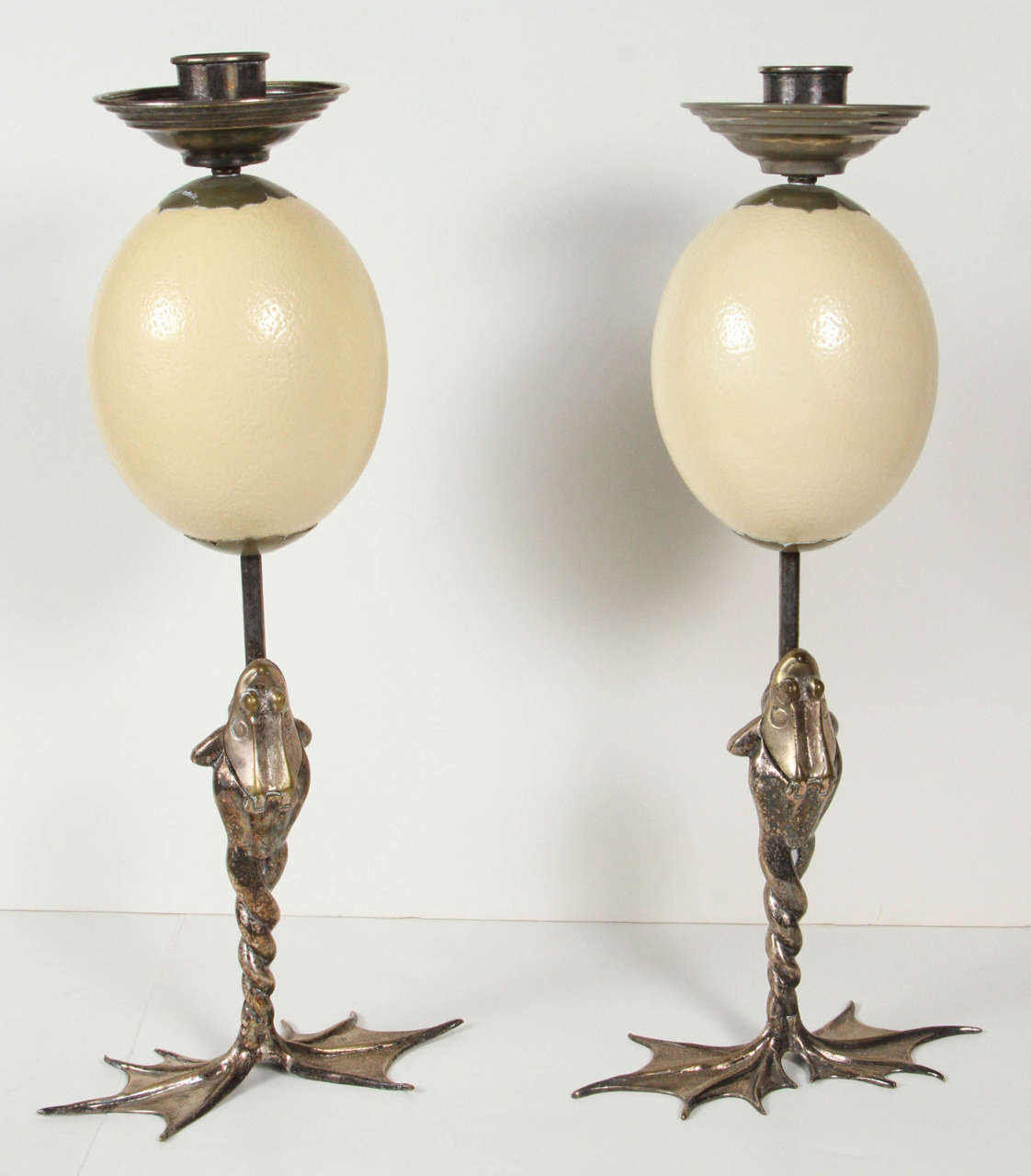 Pair of Anthony Redmile frog candlestick with ostrich eggs. The frogs mouths open to hold striker matches.
