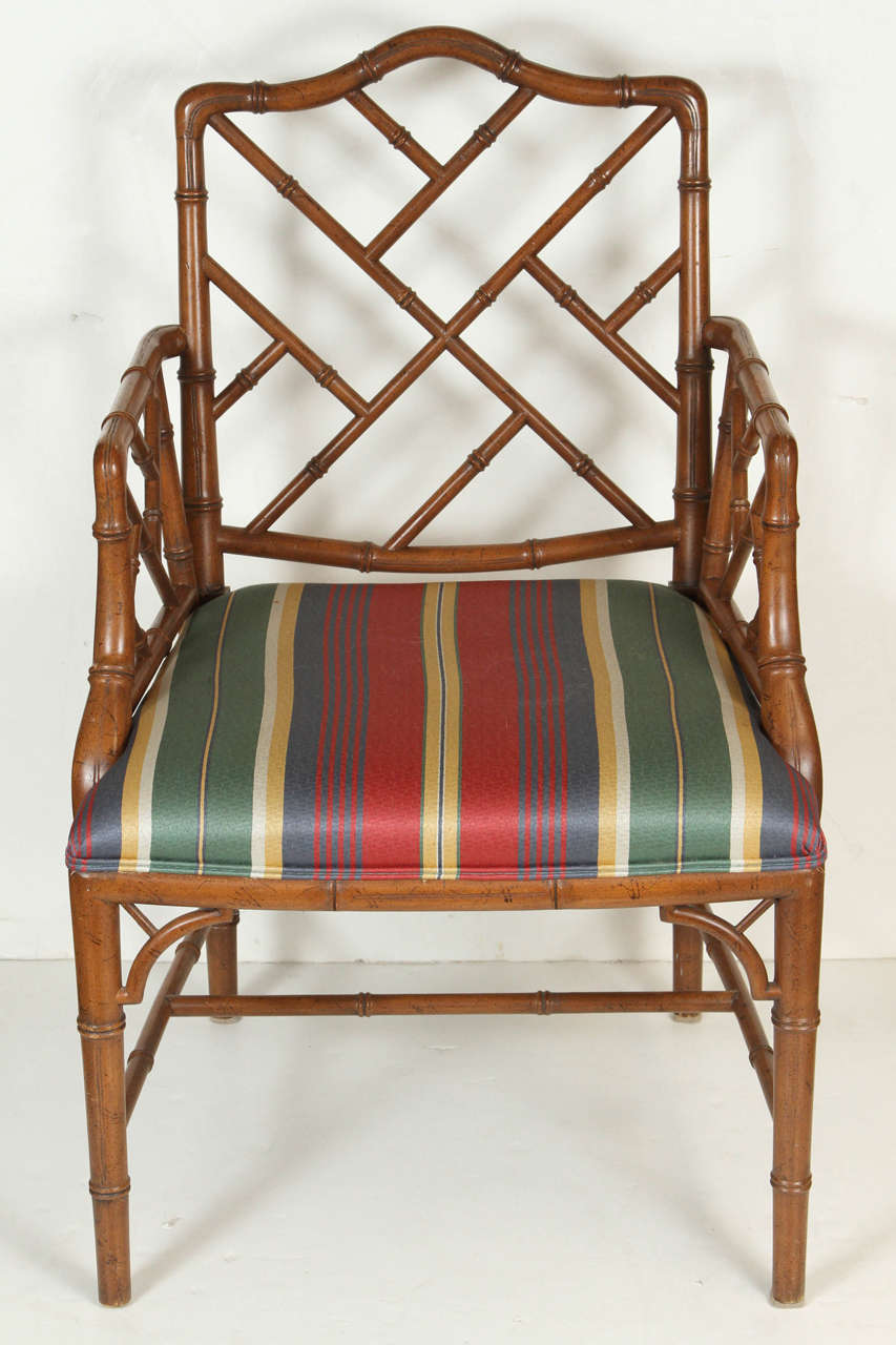 Pair of wood Chinese Chippendale style faux bamboo chairs, with upholstered seat.